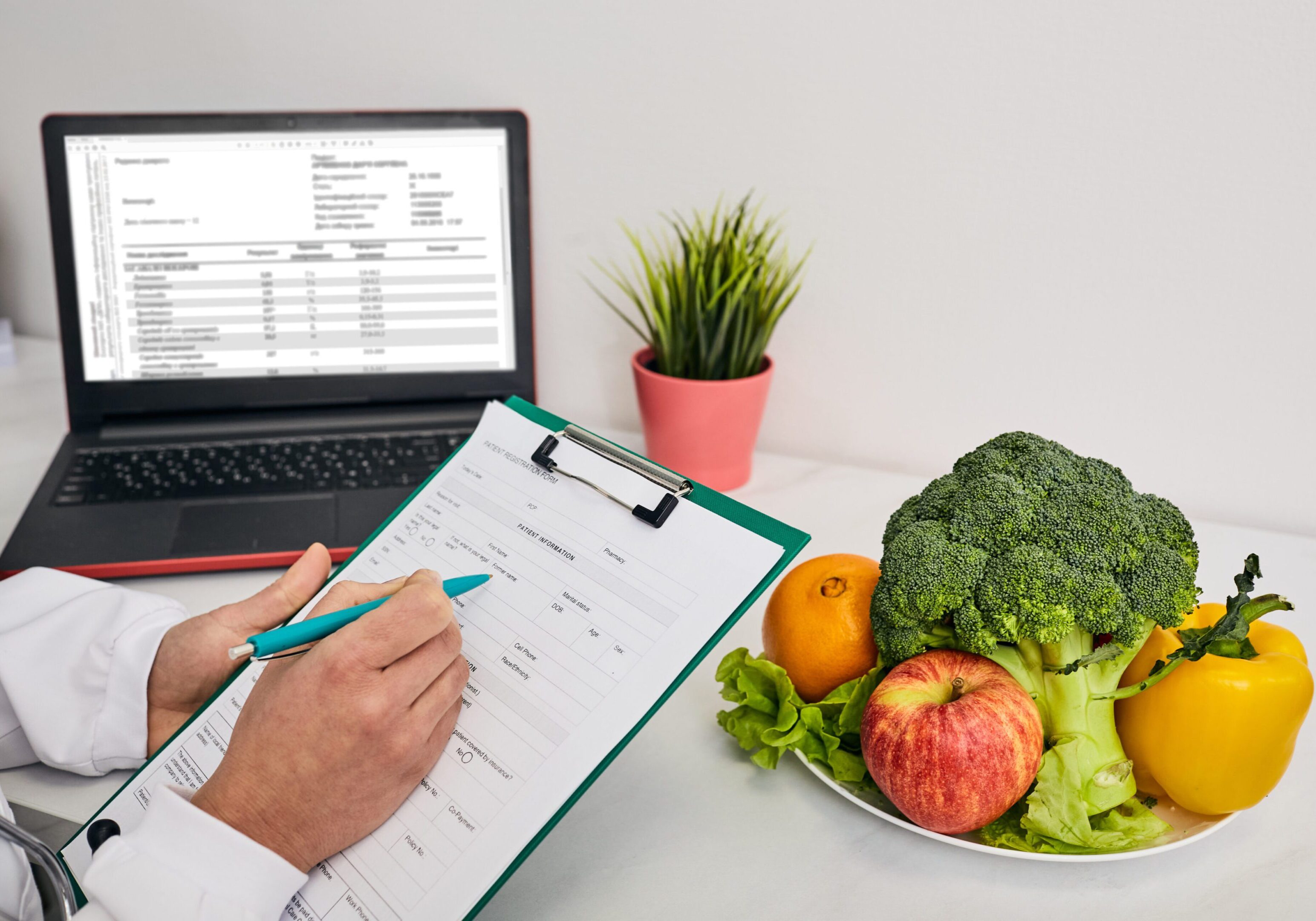 Nutritionist writing notes near fresh vegetables.